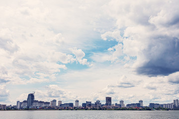 Summer day, Minsk city, apartment buildings, blue sky with clouds, copy space, toned