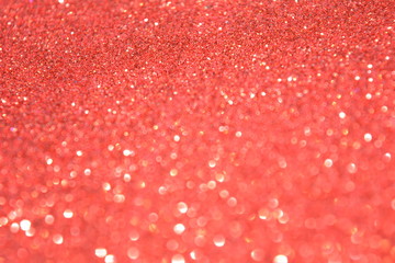 Beautiful Abstract Sparkle Glitter Lights Background. Red Scarlet. Shine Bokeh Effect. For party, holidays, celebration.