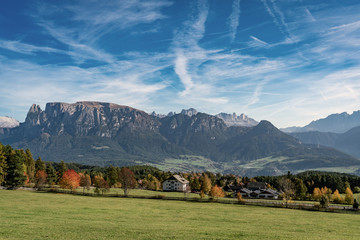 Panoramic view of the Schlern mountain massif and the village Voels am Schlern in South Tyrol seen from the Ritten