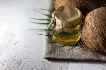 coconut and bottle of coconut palm oil. healthy food vegan aromatherapy concept