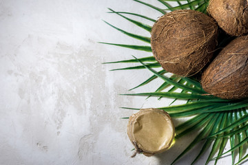 Obraz na płótnie Canvas coconut and bottle of coconut palm oil. healthy food vegan aromatherapy concept