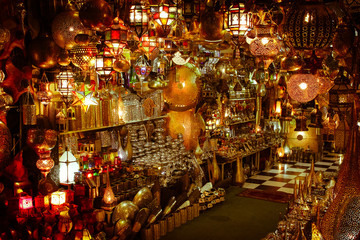 Fototapeta na wymiar Moroccan style lighting with a decorated lamps in a shop in souks in Medina Marrakech, Morocco