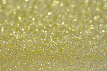 Beautiful Abstract Sparkle Glitter Lights Background. Gold Champagne. Shine Bokeh Effect. For party, holidays, celebration.