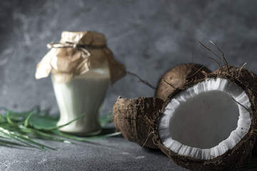 ripe chopped coconut on a gray stone background Coconut oil.