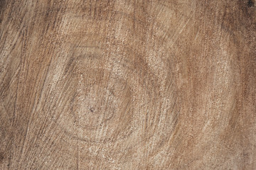 Classic brown wooden background made of natural wood in style of grunge. Side view. Cross section of the trunk, the core with annual rings. The surface of the table for shooting flat lay. Copy space