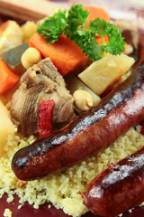 plate of royal couscous with lamb chicken and merguez