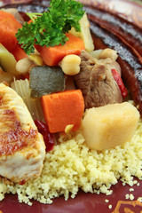 plate of royal couscous with lamb chicken and merguez
