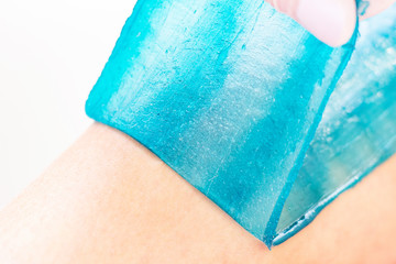 azulene depilation. wax hair removal, shugaring. concept of smooth skin without hair. azulene of...