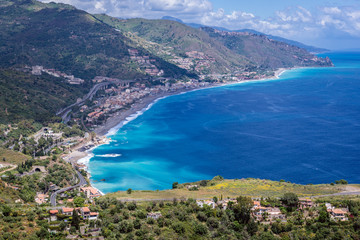 Fototapeta na wymiar Ionian Sea coast seen from a area of Greek Theatre in Taormina city, Sicily Island, Italy