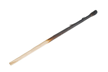 Burnt match stick close up isolated on white background
