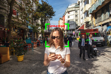 Conceptual photography - people walk on street, face recognition technology concept illustration of...