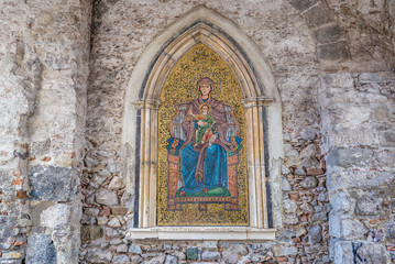 Madonna with a Child mosaic on a wall of Clock Tower located on Square of 9th April in Taromina city, Sicily Island, Italy
