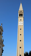 Fototapeta premium Very tall Bell Tower with Pyramidal spire with a square base and