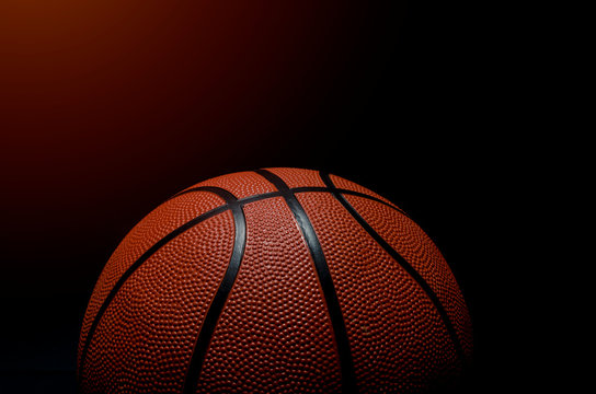 Basketball ball on black background.