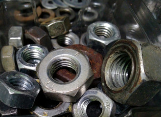 Fototapeta na wymiar Bolts close up. Background of bolts, internal screw, many screws. Factory equipment and industrial concept.
