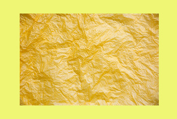 Rumpled yellow background. Real texture of the wrapping texture.