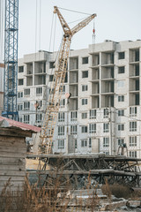 Construction site with cranes and building materials
