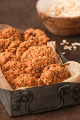 Homemade oatmeal cookies on white wooden table