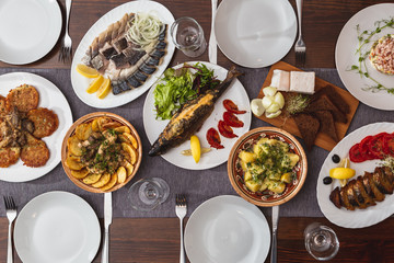 A generous and hospitable table with Ukrainian national traditional vegetable and meat dishes served to the New Year holidays, Christmas, Easter and treats for friends birthday. Top view