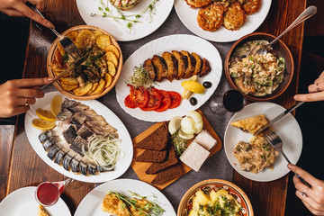 A generous and hospitable table with Ukrainian national traditional vegetable and meat dishes served to the New Year holidays, Christmas, Easter and treats for friends birthday. Top view