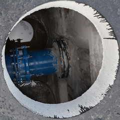 Open manhole in the concrete block
