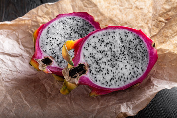 cut fresh pitahaya on a craft paper.