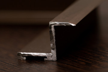Z-shaped slice of a metal profile close-up.