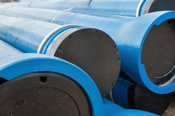 Stack of new blue pipes (tubes)