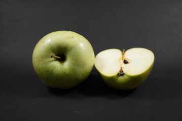 green apples on black background table