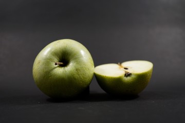 green apples on wooden table