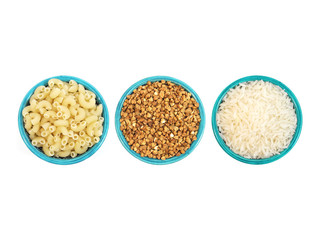 Macaroni, buckwheat and rice in ceramic blue bowls isolated on white background