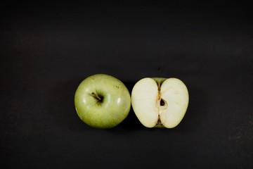 top green apples on black background