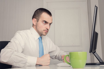 Angry manager working in the office, portrait, toned