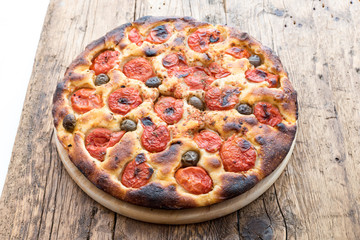 Focaccia typical of Bari Italy with tomatoes and olive