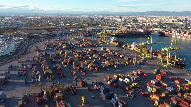 Valencia harbour commercial dock full of containers Spain aerial trucks loading 