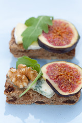 Tasty open sandwiches with fig fruits.