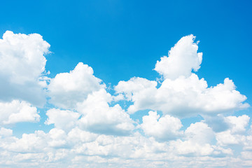 Naklejka na ściany i meble Blue sky with fluffy clouds, abstract background