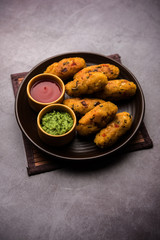 Veg Poha Roll made using flattened Rice, served with tomato ketchup and green chutney