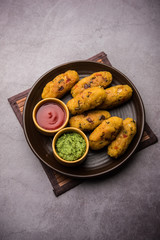 Veg Poha Roll made using flattened Rice, served with tomato ketchup and green chutney