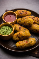 Veg Poha Roll made using flattened Rice, served with tomato ketchup and green chutney
