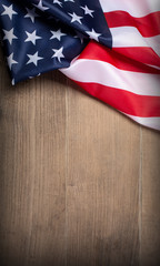 US flag on wooden background. N