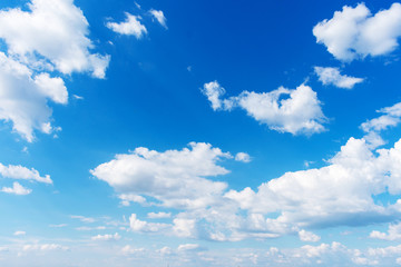 Obraz na płótnie Canvas Blue sky with fluffy clouds, abstract background