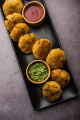 Veg Poha Cutlet or flattened Rice Patties served with tomato ketchup and green chutney