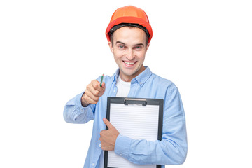 Builder in hardhat, man smiling and indicates at you, man holding a notepad, isolated background, copy space