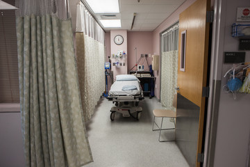 Hospital emergency room bay with empty gurney