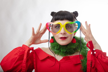 Model, emotions, portrait. Beautiful girl in a red sweater, cheerful mood, red jacket, New Year's outfit, beautiful look, charming model.