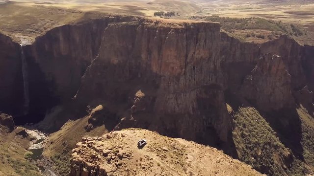 Aerial view of jeep and travellers at viewpoint near Maletsunyane Falls in Lesotho