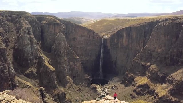 Aerial view of traveller at viewpoint near Maletsunyane Falls in Lesotho