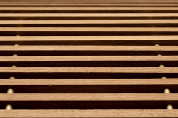 Abstract background in the form of gorizontal lines of a wooden structure close-up.
