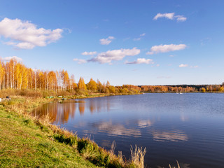 colorful autumn landscape by the lake, golden autumn, colorful trees and reflections